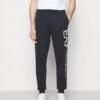 EA7 Emporio Armani TrouserPantaloni SportiviDark Blue/White Uomo Pantaloni Sportivi E Joggers EA722E00P-K11 -Pier One Italia 2025 5a5a794466db4907a5838f255b10de65