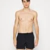 Champion Shorts Da MareBlack Uomo Moda Mare C7682H01X-Q11 -Pier One Italia 2025 f30b0a6653704058a14c8aa0afd72f89